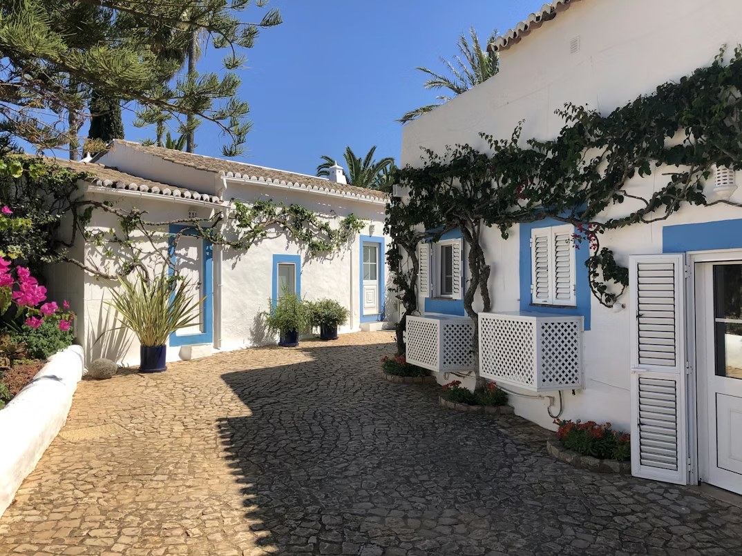 Traditional Algarve villa with whitewashed walls and blue trim, Silves